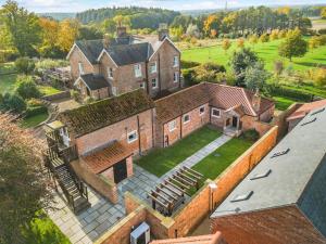 an aerial view of a large brick house at 1 Bed in Crayke oc-g33754 in Crayke