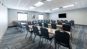 a conference room with tables and chairs and a screen at Holiday Inn Express Hotel & Suites Anderson by IHG in Anderson +73 photos