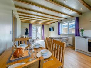a kitchen and dining room with a table and chairs at 2 Bed in Lancaster oc-53510 in Beetham