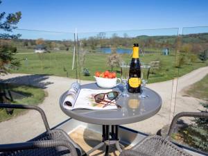 a table with a bottle of wine and a bowl of fruit at 1 Bed in Richmond oc-82829 in Gilling