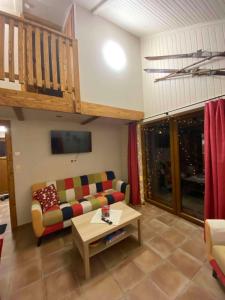 a living room with a couch and a table at Apartmany U vleku 6 in Ceske Petrovice
