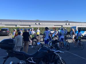 a group of people on bikes in a parking lot at BRAUCOL Hotel in Brens