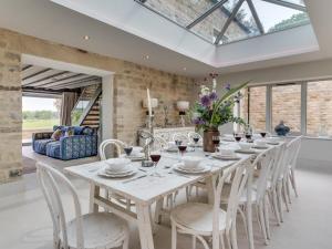 a dining room with a white table and chairs at 6 Bed in Richmond oc-80466 in Gilling +28 photos