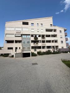 a large white building with a lot of windows at Maison Piave 35 in Olbia