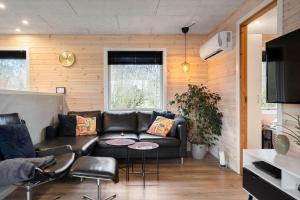 a living room with a couch and a table at LF127-Vestervig-Gunhildsvej-27 in Vestervig