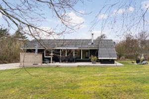 a house with a metal roof on top of a yard at LF127-Vestervig-Gunhildsvej-27 in Vestervig