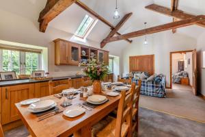 a kitchen and dining room with a wooden table at 2 Bed in Belsay oc-t29653 in Bolam
