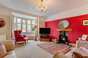 a living room with a red wall at 3 Bed in Askrigg oc-h29661 in Askrigg