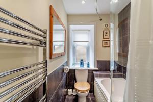 a bathroom with a tub and a toilet and a sink at 3 Bed in Askrigg oc-h29661 in Askrigg +19 photos