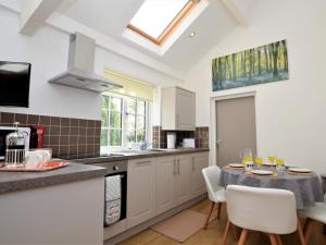 a kitchen with a table and chairs in a kitchen at 2 Bed in Middlesbrough oc-75544 in Stokesley +17 photos