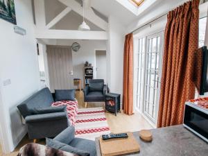 a living room with two couches and a tv at 2 Bed in Middlesbrough oc-75544 in Stokesley