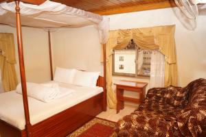Postel nebo postele na pokoji v ubytování Vision Hotel Kampala