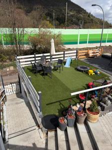 a patio with a table and chairs and grass at Casa Tua An der Weinstraße in Neustadt an der Weinstraße +11 photos