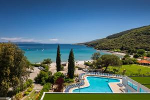 a view of a resort with a swimming pool and a beach at MASLINICA Oliva Camping Pitches in Rabac