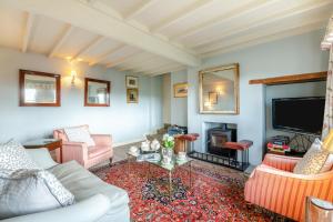 a living room with a couch and a fire place at 2 Bed in Harmby oc-t30971 in Hornby