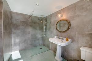 a bathroom with a sink and a mirror at 2 Bed in Harmby oc-t30971 in Hornby +22 photos