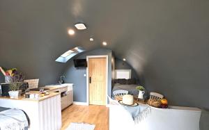 a kitchen and living room with a sink and a door at 1 Bed in Rocester oc-o33055 in Rocester