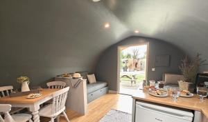 a living room with a table and a couch at 1 Bed in Rocester oc-o33055 in Rocester