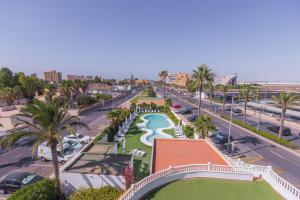 an aerial view of a resort with a pool and palm trees at BLUESEA Brisa Roquetas in Roquetas de Mar