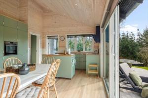 a kitchen and dining room of a tiny house at JB408-Brovst-Urbakken-2 in Brovst