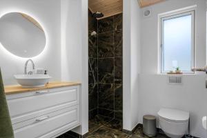 a bathroom with a sink and a shower at JB408-Brovst-Urbakken-2 in Brovst +19 photos