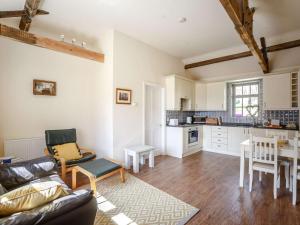 a living room with a couch and a table at 1 Bed in Hexham oc-82473 in Hexham +12 photos