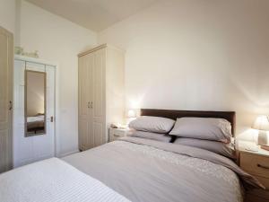 a bedroom with a white bed with two pillows at 1 Bed in Hexham oc-82473 in Hexham