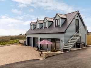 a large house with a roof with a staircase at 1 Bed in Weymouth oc-82098 in Osmington
