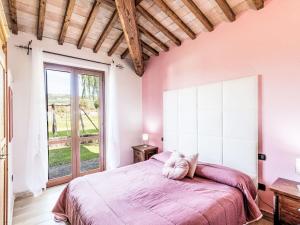 a bedroom with a large bed and a large window at Apartment Casa Domenico 2 by Interhome in Montefiascone