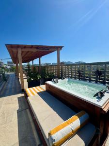 a hot tub on the roof of a building at Hotel Boutique Casa Mia in Santa Marta