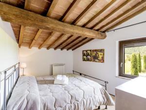 a bedroom with a large bed and a window at Apartment Casa Ricardo n- 4 by Interhome in Montefiascone