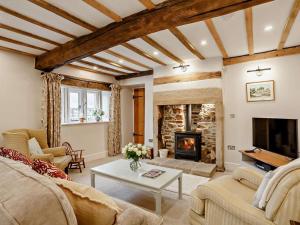 a living room with a couch and a fireplace at 2 Bed in Skipton oc-91296 in Bramley