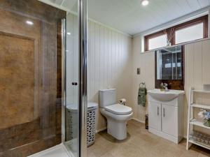 a bathroom with a toilet and a shower and a sink at 2 Bed in Sowerby Bridge oc-90887 in Sowerby Bridge +13 photos