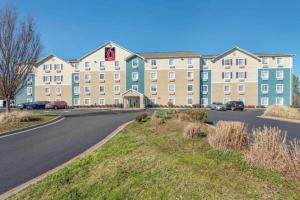 a large building with a road in front of it at Studio 6 Extended Stay Little Rock Southwest AR in Little Rock