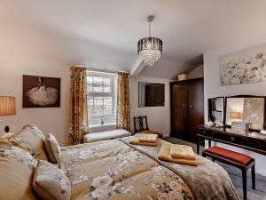a bedroom with a large bed and a desk at 2 Bed in Consett oc-91440 in Hunstanworth