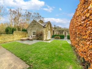 a stone house with a large yard in front of it at 2 Bed in Consett oc-90576 in Whittonstall