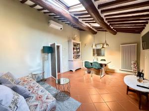 a living room with a couch and a table at Galli Tassi Suite in Lucca