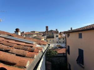 a view of a city from the roofs of buildings at Galli Tassi Suite in Lucca