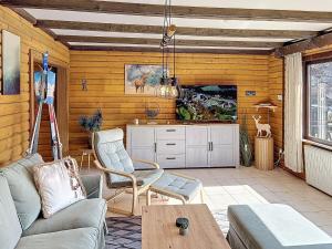 a living room with a couch and a table at Apartment Franzi 2 by Interhome in Arrach