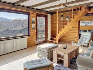 a living room with a table and a large window at Apartment Franzi 2 by Interhome in Arrach +31 photos