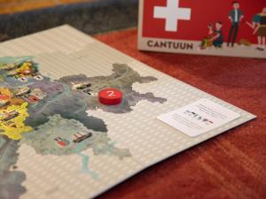 a miniature map of the united states with a red ball at Apartment Centaure B RI 1 by Interhome in Ovronnaz +21 photos