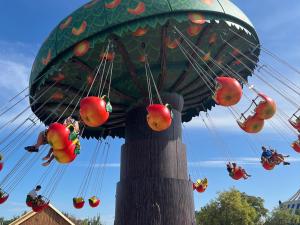 a ride at a theme park with apples on it at Hotel Cigoland in Kintzheim