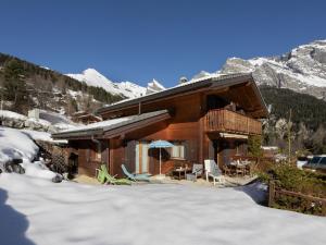 a log cabin in the snow in the mountains at Chalet Orchidée by Interhome in Ovronnaz