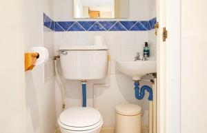 a small bathroom with a toilet and a sink at The Blue Lobster in Drynoch +52 photos
