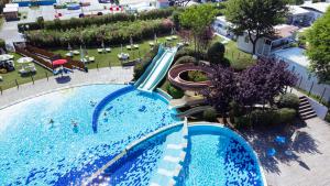 an overhead view of a water slide at a resort pool at Glamping Lido di Spina in Lido di Spina