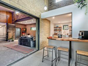 a kitchen with a bar and a living room at 3 Bed in Sheffield oc-94342 in Thurlstone
