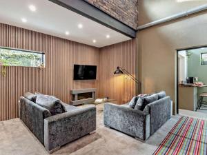 a living room with two couches and a tv at 3 Bed in Sheffield oc-94342 in Thurlstone
