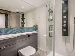 a bathroom with a toilet and a glass shower at 3 Bed in Sheffield oc-94342 in Thurlstone +19 photos