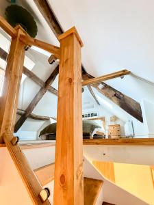 a wooden beam in a room with a ceiling at Broadweavers - Very Cute Cottage In Dursley By STAE-Homes in Gloucestershire