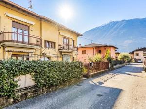 a street with houses and a mountain in the background at Apartment Casa Silvia by Interhome in Carlazzo